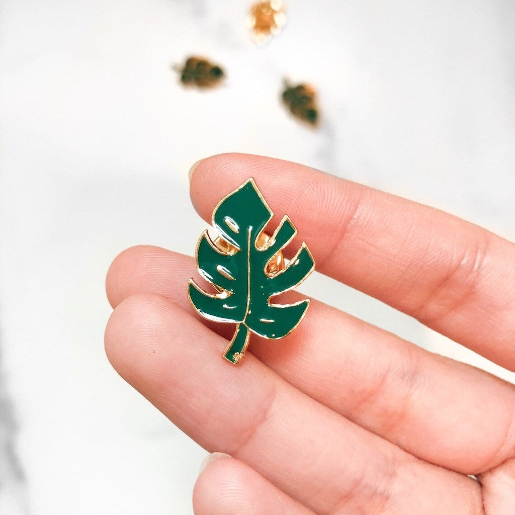 Monstera Leaf Enamel Lapel Pin in hand