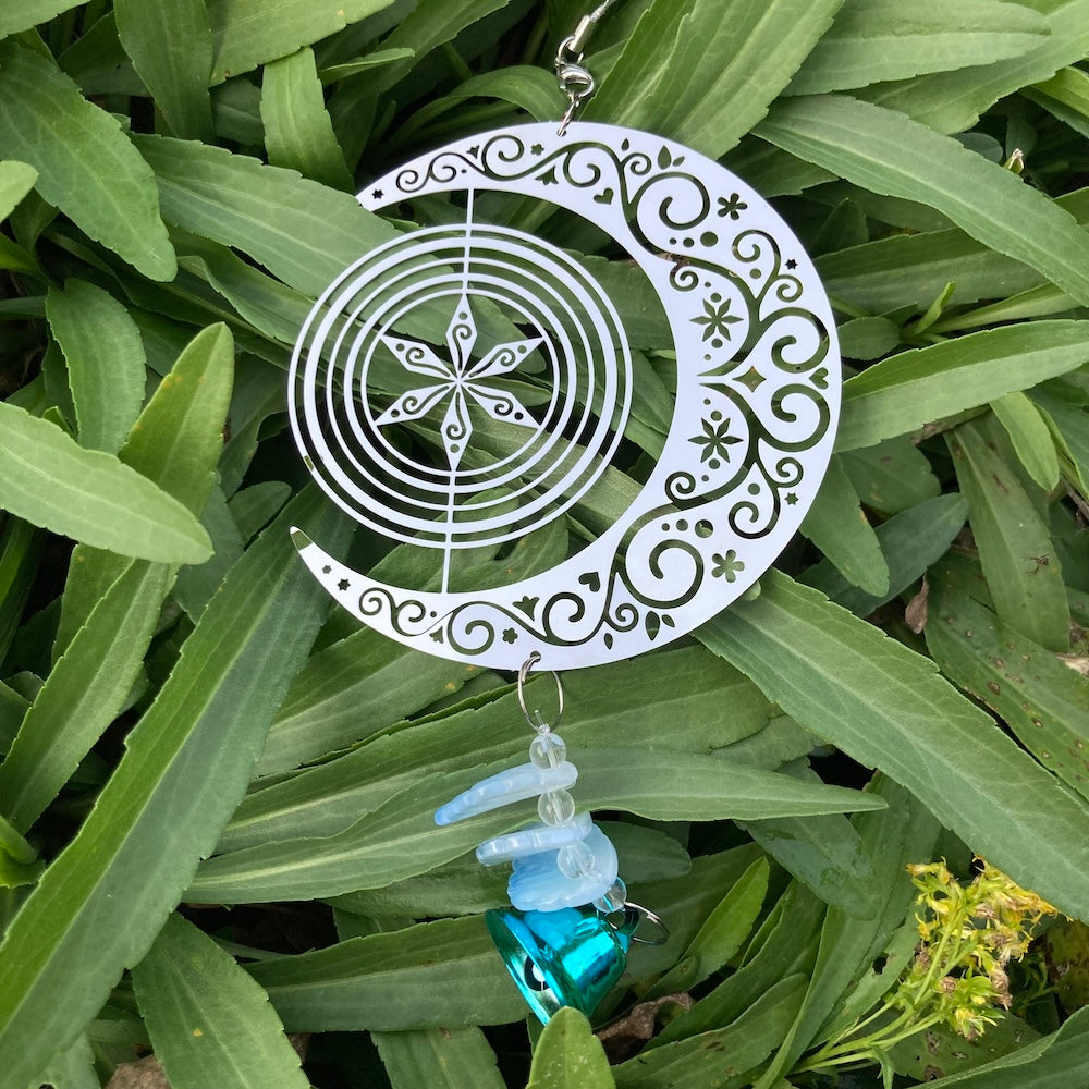 Rotating Moon Wind Chime Hanging Decor on grass