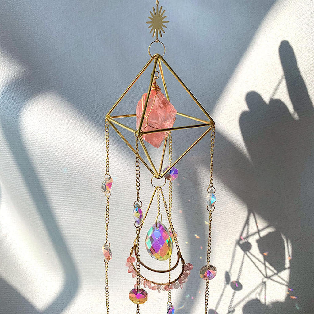 Raw Crystal Suncatcher (Red Melting) hanging
