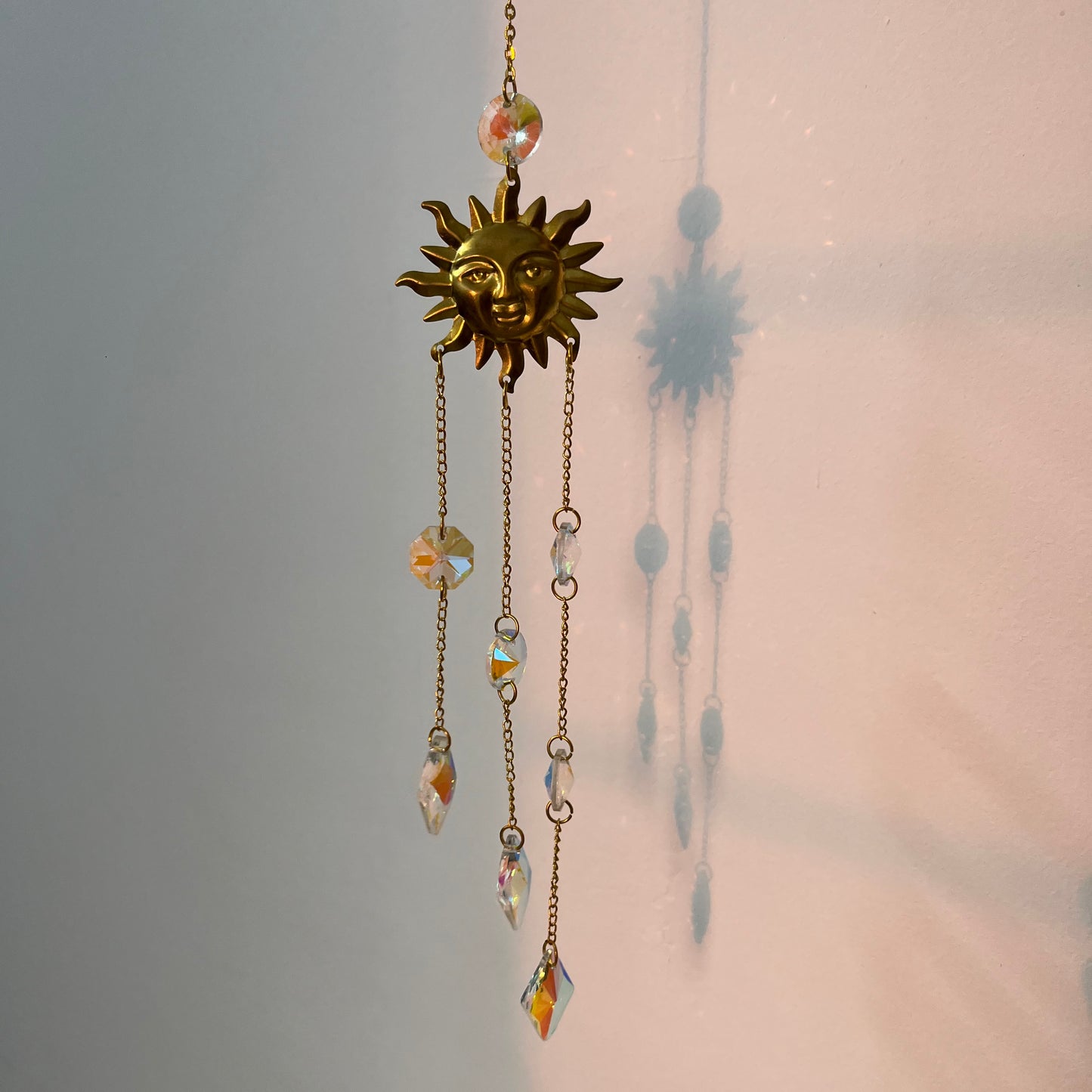 Surya Crystal Suncatcher in sunlight