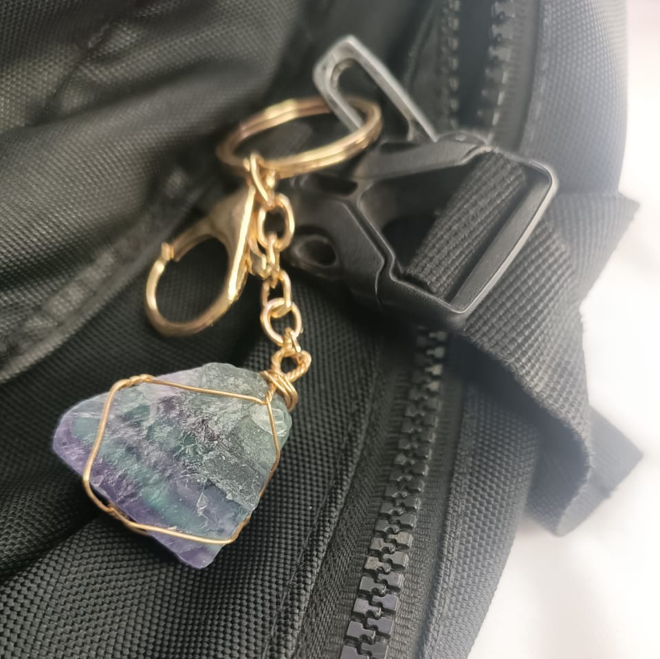 Raw Crystal Keychain with Lobster Hook (Rainbow Fluorite) on bag