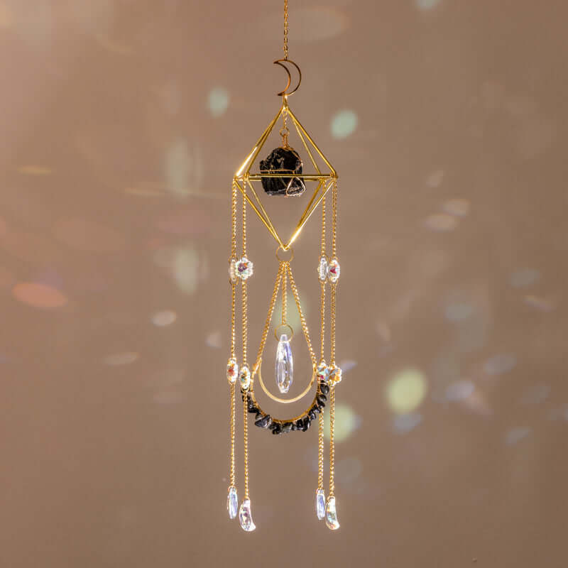 Raw Crystal Suncatcher (Obsidian) hanging