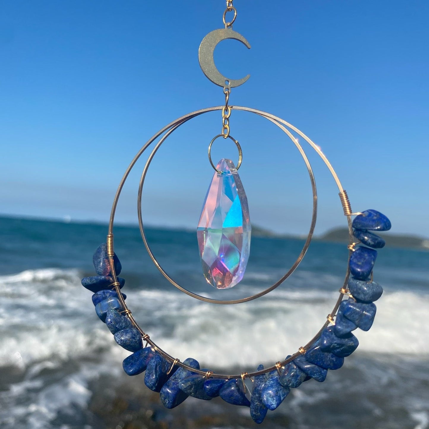 Lapis Lazuli hanging quartz crystal suncatcher in sunlight
