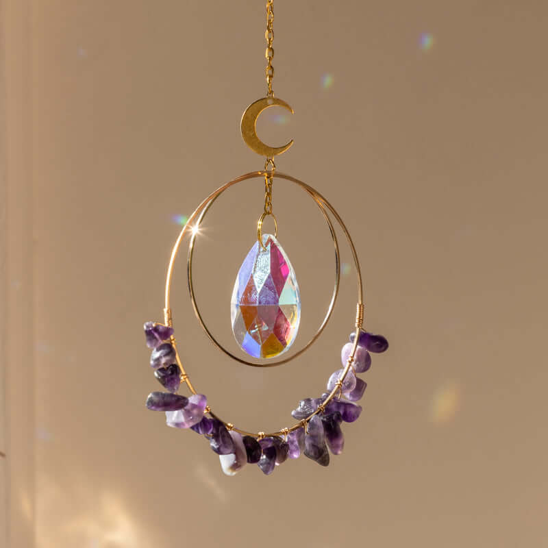 Hanging round quartz crystal chips suncatcher in sunlight