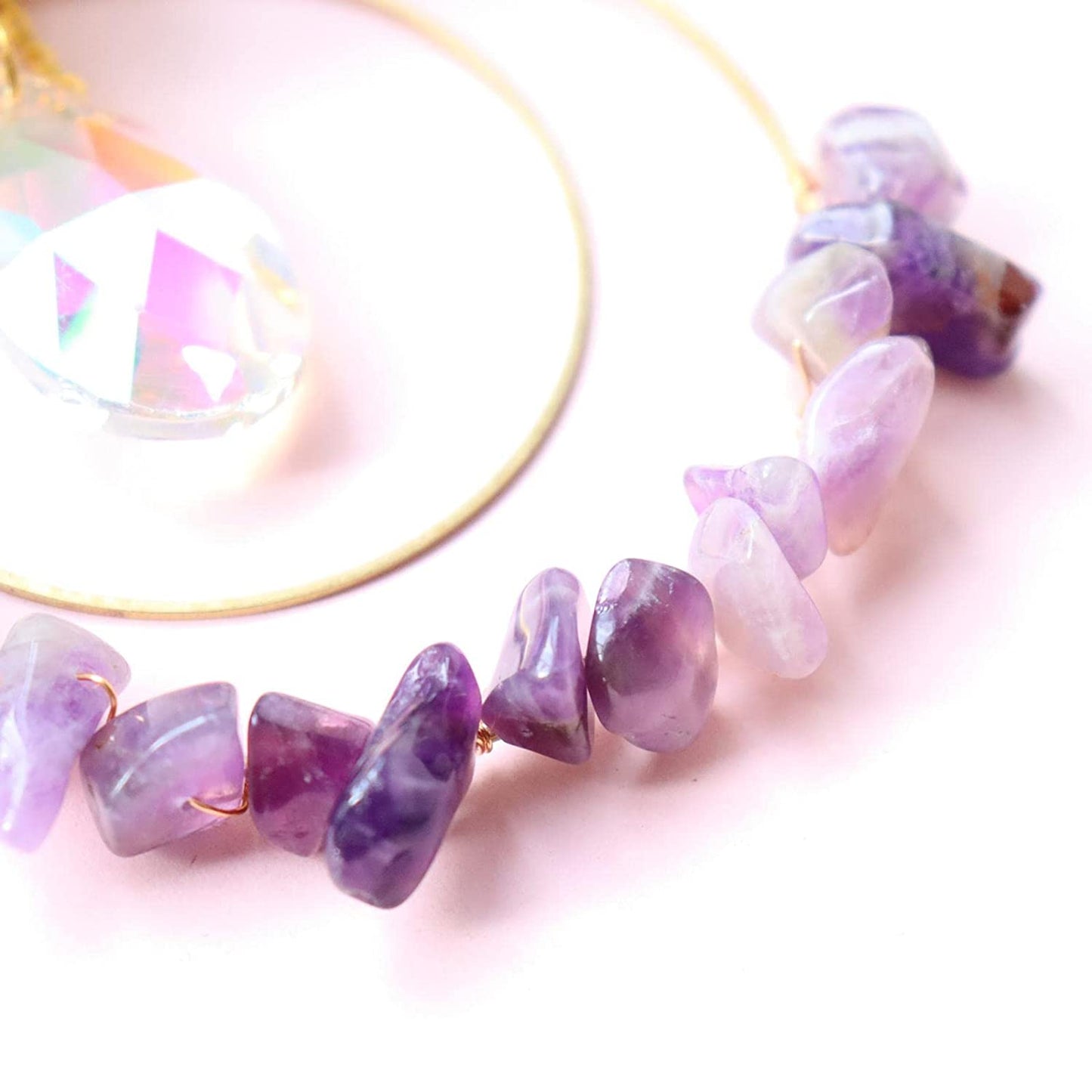 Hanging round quartz crystal chips suncatcher in sunlight