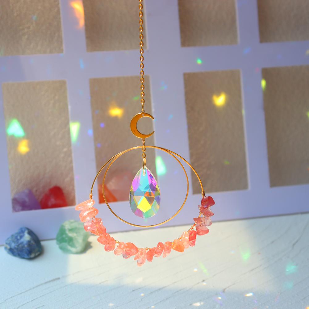 Red Melting Hanging quartz crystal suncatcher in sunlight making rainbow