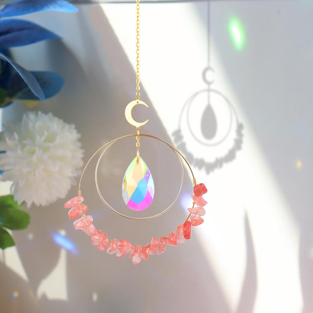 Red Melting Hanging quartz crystal suncatcher in sunlight making rainbow