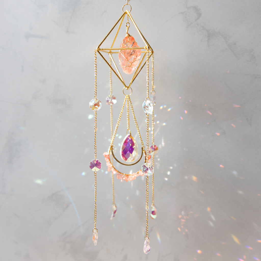 Raw Crystal Suncatcher (Himalayan Orange Salt) hangi9ing