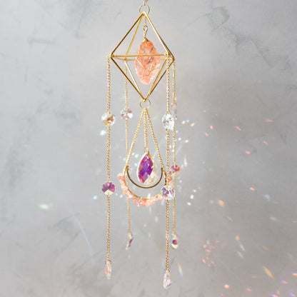 Raw Crystal Suncatcher (Himalayan Orange Salt) hangi9ing