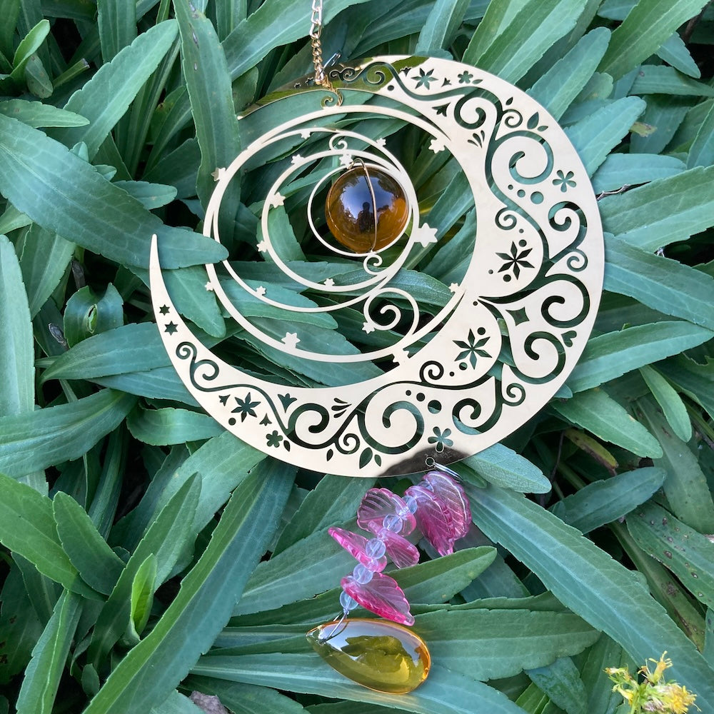 Rotating Golden Moon with Crystal Glass Ball Hanging Decor on grass