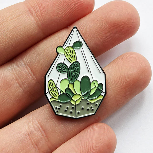 Diamond Terrarium Enamel Lapel Pin in hand