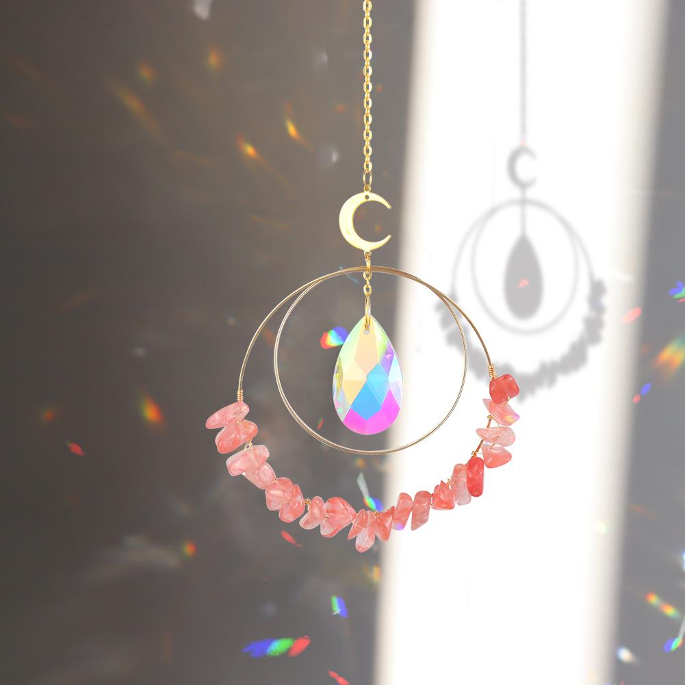 Red Melting Hanging quartz crystal suncatcher in sunlight making rainbow